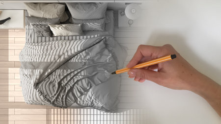 Architect interior designer concept: hand drawing a design interior project while the space becomes real, classic modern white and wooden bedroom with double bedの写真素材