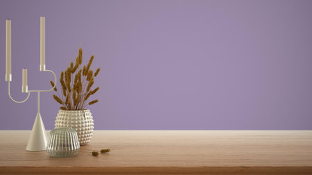 Empty interior design concept, wooden table, desk or shelf close up. Ceramic and glass vases with dry plants, straws. Purple background with copy space, template mock up ideaの写真素材