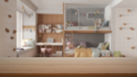Empty wooden table, desk or shelf with blurred view of children bedroom, bunk bed with decors, desk and toys, modern interior design conceptの写真素材