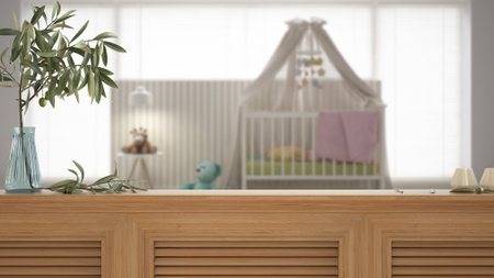 Wooden table top, cabinet, panel or shelf with shutters close up. Olive branch in vase and candles. Blurred background with scandinavian nursery, children room, interior designの写真素材