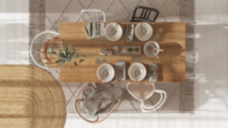 Blurred background, wooden country dining table with table setting. Jute carpet. Scandinavian boho...