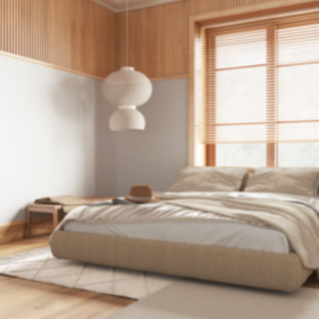 Blurred background, farmhouse bedroom with wooden walls. Parquet floor, master bed, carpets and decors. Contemporary interior designの写真素材