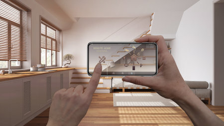 Smart remote home control system on a smart phone. Device with app icons. Interior of minimal japandi kitchen and living room in the background, architecture designの写真素材