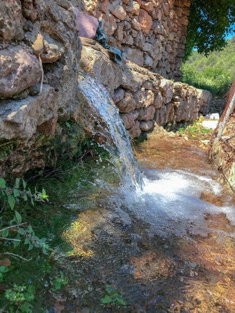 Waterfall in a small village in the mountains, Crete, Greeceの写真素材