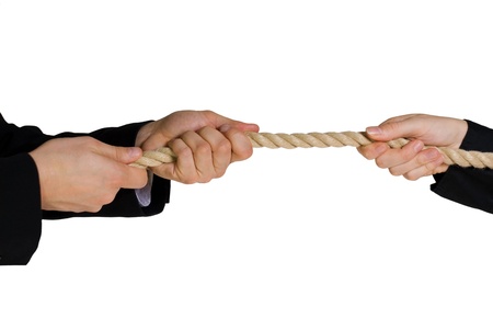 some business hands doing tug of war symbolizing rivalry in business sectorsの写真素材