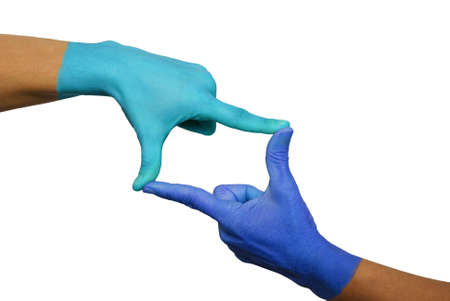two blue hands form a frame with their fingers on whiteの写真素材