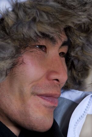 man in outline who looks asian or inuit with coat above his headの写真素材