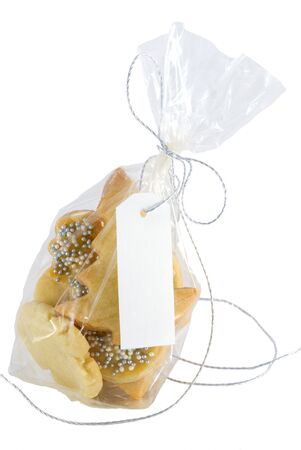 bag full of home-baked christmas cookies with white label with copyspace on it, isolatedの写真素材