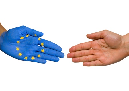 a handshake between two hands, one painted with the european flagの写真素材