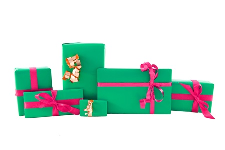 many gifts in green with pink ornamentation, on white