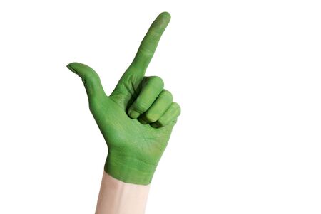 a green painted hand showing an okay gestureの写真素材