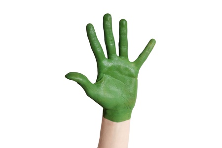a green painted hand isolated, symbolizing nature and environmentの写真素材
