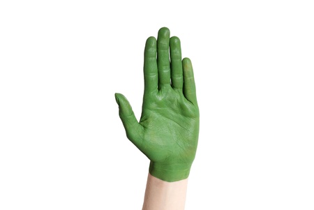 a green painted hand symbolizing nature and environmentの写真素材