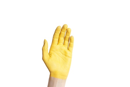 a yellow hand isolated on whiteの写真素材