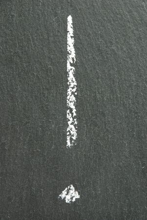 an interrogation mark on a dark blackboardの写真素材