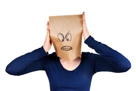 a angry person with a paper bag hadの写真素材