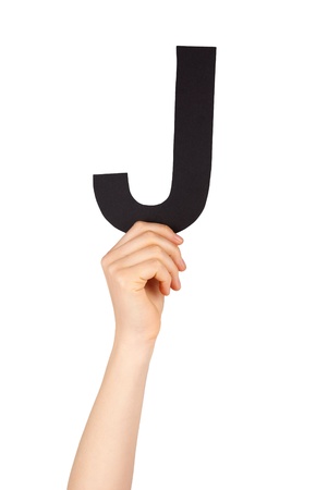 the letter J, hold by a hand, isolatedの写真素材