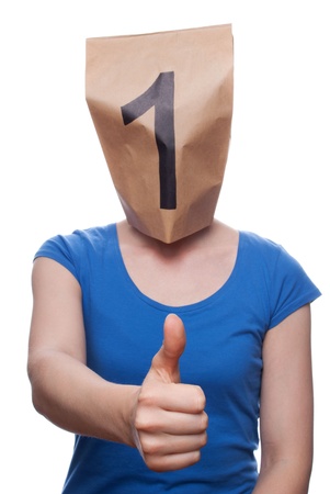 a person with a paper bag head showing a one, isolatedの写真素材