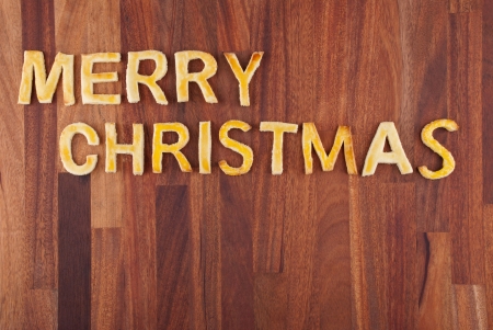 the word merry christmas build with cookies as christmas backgroundの写真素材
