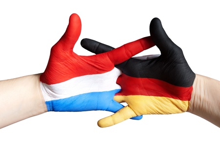 hands symbolizing the relation between dutch and germanyの写真素材