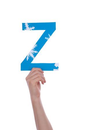 A Hand Holding the Snowy and Blue Letter Z, Isolatedの写真素材
