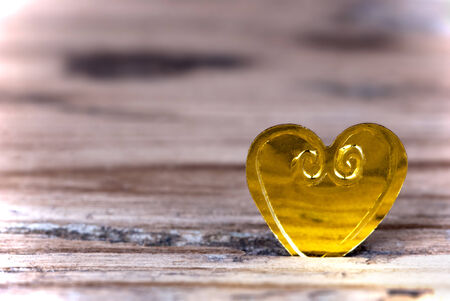 Macro of a Little Heart on a light Wooden Backgroundの写真素材