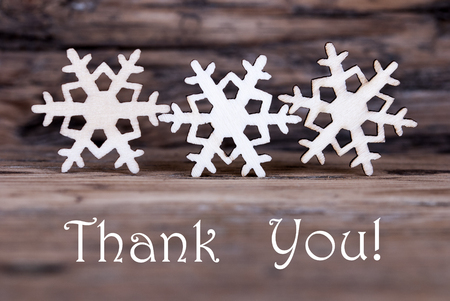 Three Wooden Snowflakes with the Words Thank Youの写真素材