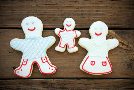 Three Colorful Cookies, Mother, Father and Child, being Happy, Happy Christmas or Winter Family Backgroundの写真素材
