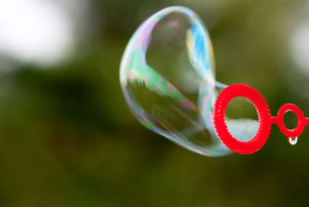 Close Up Of One Soap Bubble Which Is Blowing Up