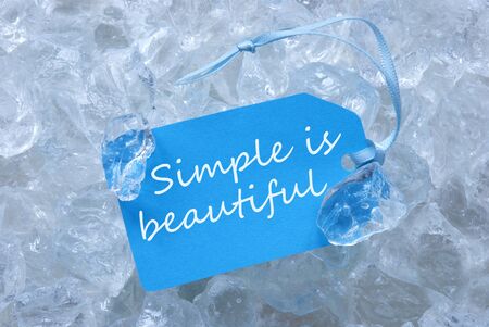 Light Blue Label With Ribbon On White Transparent Curshed Ice Cubes As Background. English Quote...