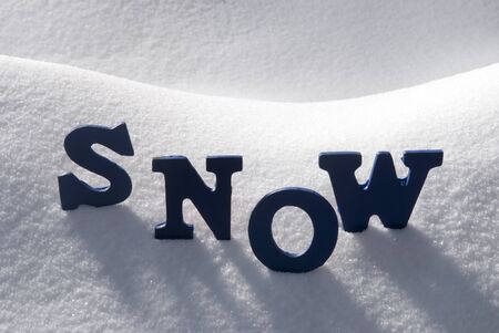 Blue Letters Building English Text Snow On White Snow. Snowy Landscape Or Scenery. Christmas Card For Seasons Greetings Or Usable As Background.の写真素材