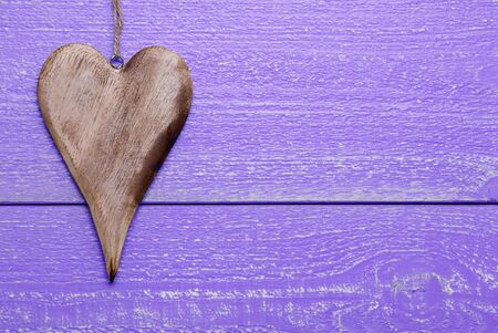 One Heart On Purple Wooden Background. Greeting Card For Valentines Day. Copy Space For Advertisement. Rustic, Retro Or Vintage Styleの写真素材