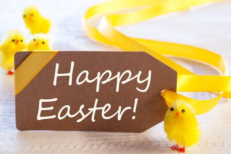 One Brown Label With Yellow Ribbon And Chicks. English Text Happy Easter. Card For Easter Greetings...