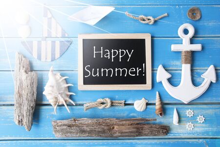Flat Lay Of Chalkboard On Blue Wooden Background. Sunny Nautic Or Maritime Summer Decoration As Holiday Greeting Card. English Text Happy Summerの写真素材