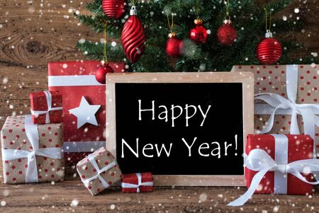 Colorful Christmas Card For Seasons Greetings. Christmas Tree With Balls And Snowflakes. Gifts Or Presents In The Front Of Wooden Background. Chalkboard With English Text Happy New Yearの写真素材