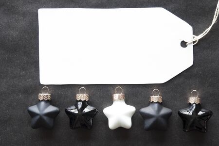 Label With Copy Space For Advertisement. Black And White Christmas Tree Balls On Black Paper...
