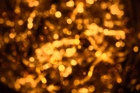 Glowing Bronze Lights Background, Party, Celebration Or Christmas Textureの写真素材