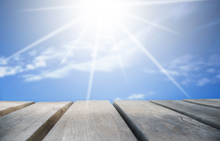 Wooden Board With Sunny Blue Sky As Backgroundの写真素材