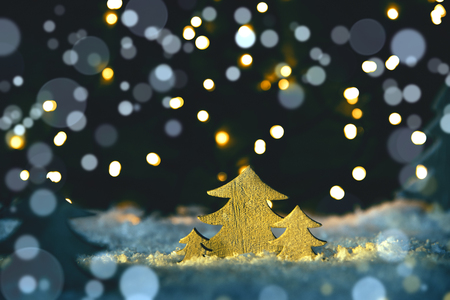 Wooden Christmas Trees, Snow, Blue Lights And Bokeh Backgroundの写真素材