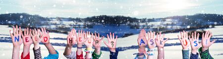 Children Hands Building Colorful Word Need Help Ask Us. Snowy Winter Background With Snowflakesの写真素材