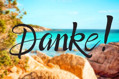Rock Beach On The Island Of Sardinia. German Text Danke Means Thank You. Beautiful Scenery And...