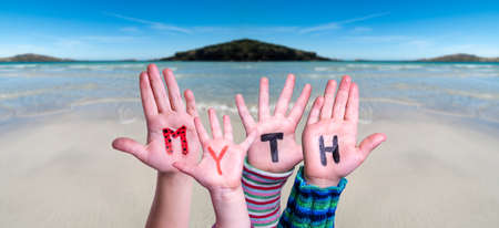 Kids Hands Holding Word Myth, Ocean Backgroundの写真素材