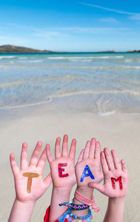 Children Hands Building Word Team, Ocean Background