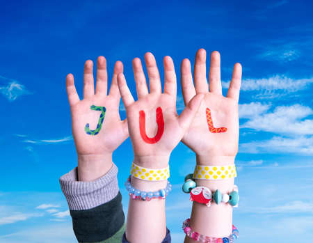Children Hands Building Word Jul Means Christmas, Blue Skyの写真素材