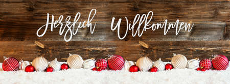 Banner Of Christmas Ball Ornament, Snow, Herzlich Willkommen Means Welcomeの写真素材