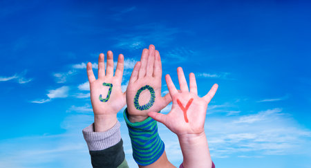 Children Hands Building Word Joy, Blue Sky