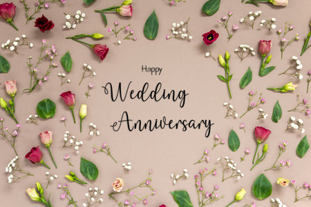 Colorful Spring Flower Arrangement With Roses, Text Happy Wedding Anniversaryの写真素材
