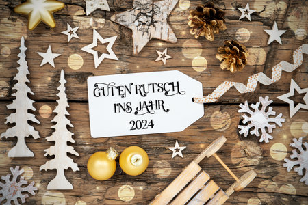 Text Guten Rutsch 2024, Means Happy 2024, Rustic Wooden, Golden Christmas Decorの写真素材