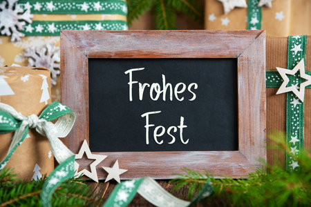 Text Frohes Fest, Means Happy Holidays, With Green Sustainable Winter Decorの写真素材