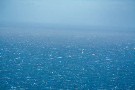 lonely sailboat on the sea